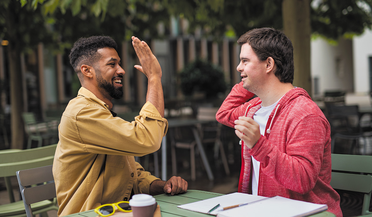 Black man and White Man High Fiving