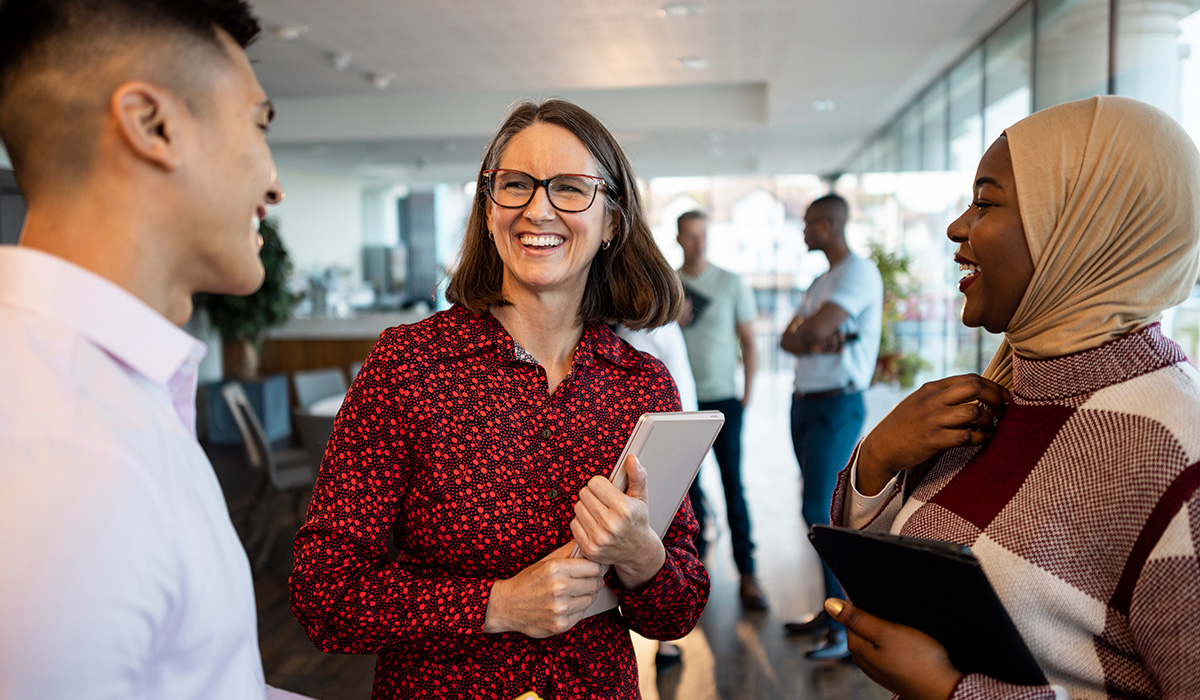 Lady smiling with colleagues