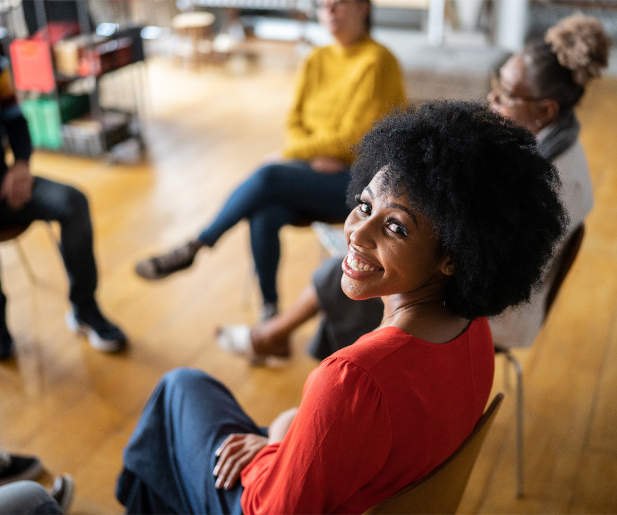 Female smiling in a meeting